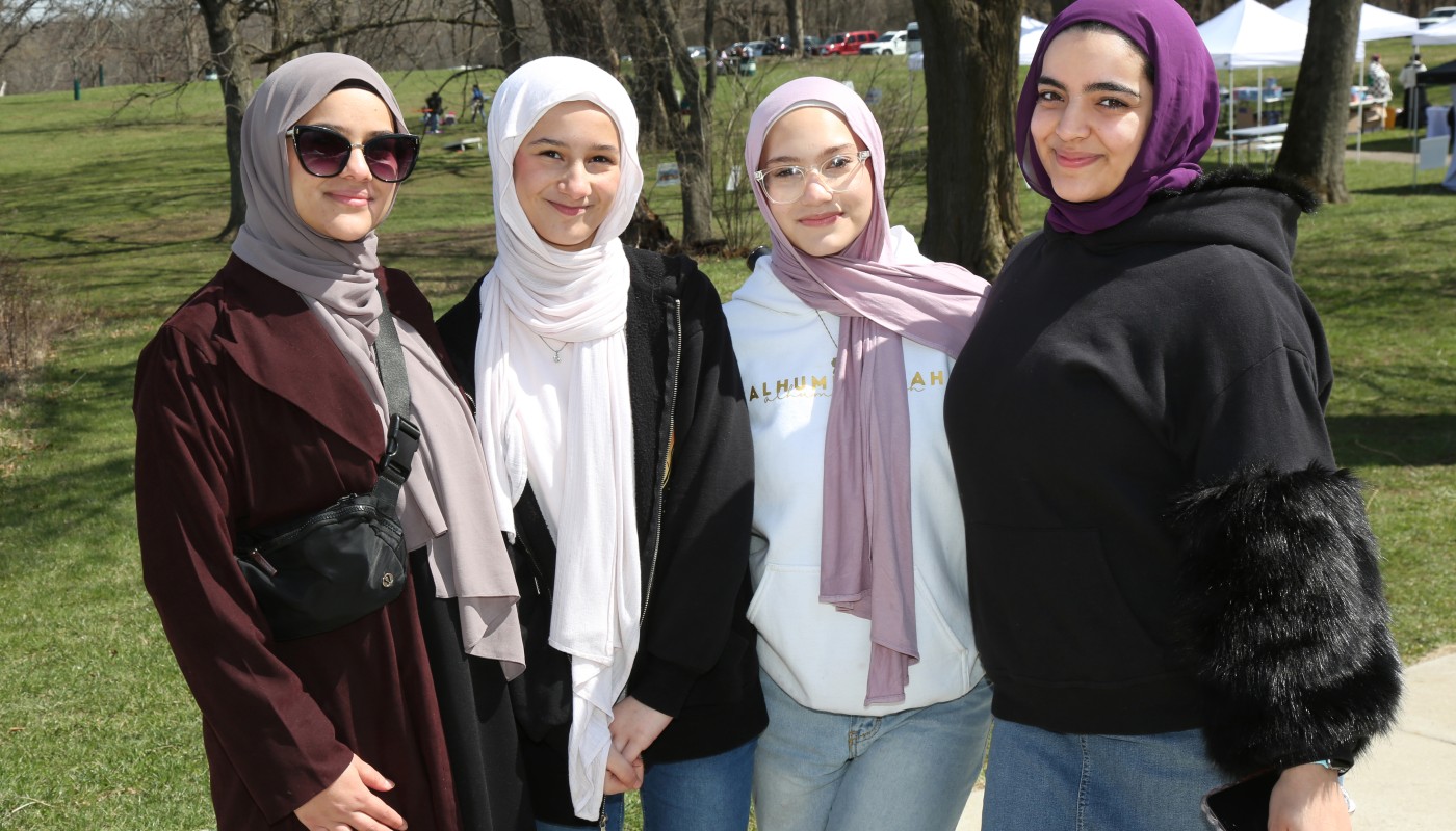 A group standing together outdoors at an event.