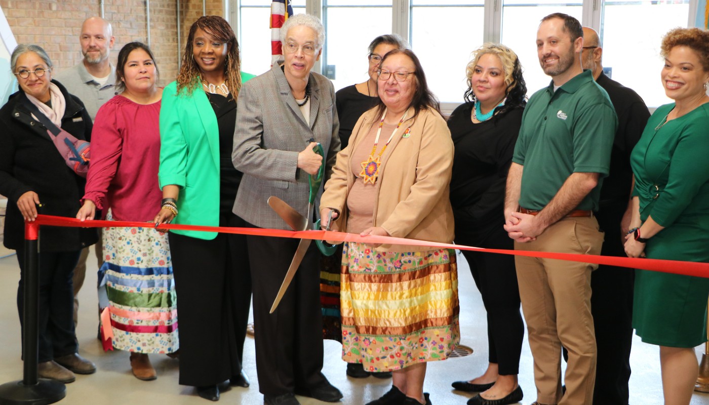 A group of people at a ribbon-cutting ceremony.
