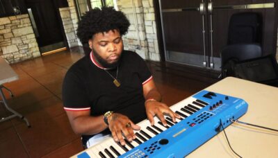 A person playing a keyboard piano.