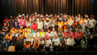 A large group of people pose for a photo.