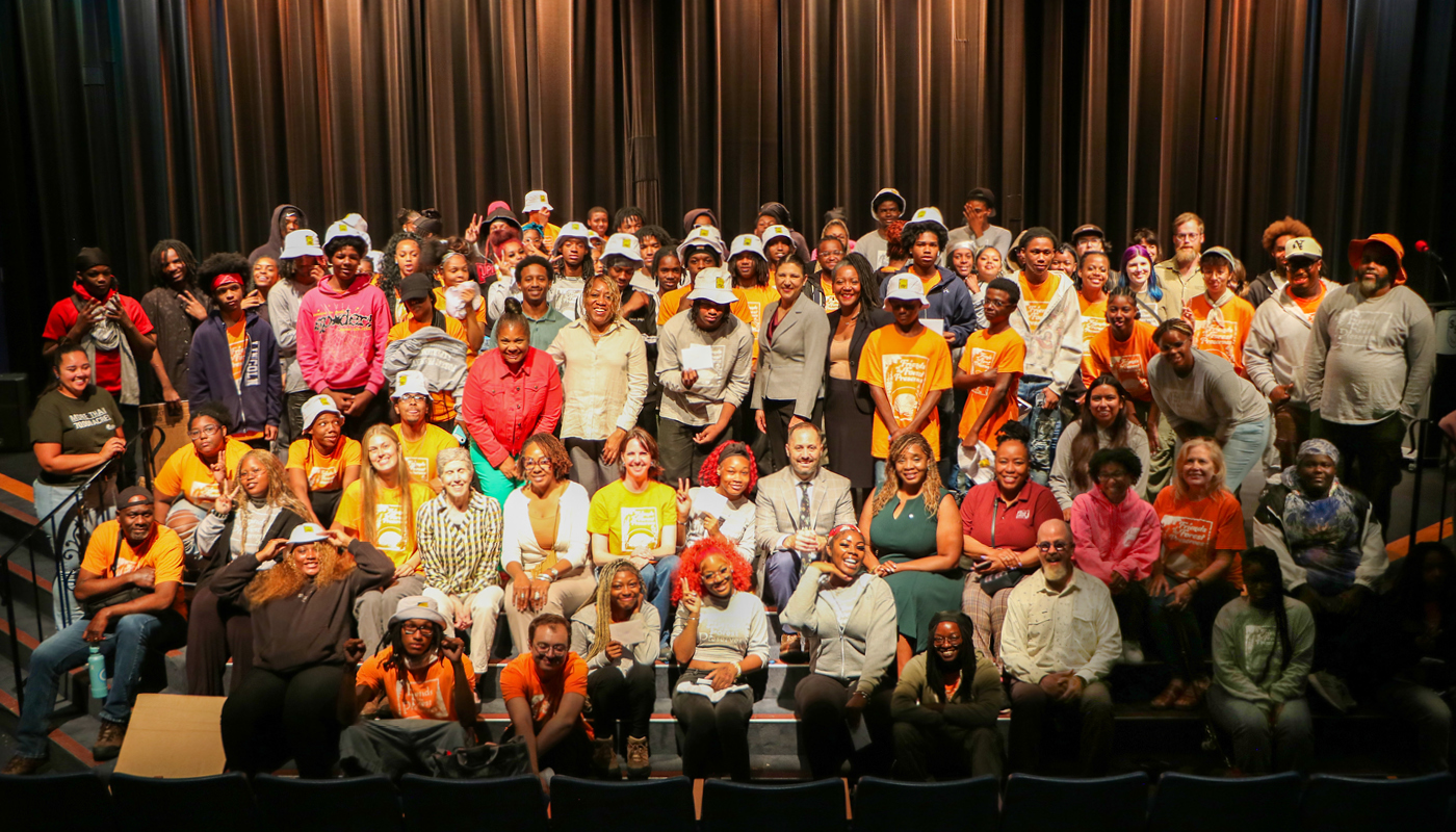 A large group of people pose for a photo.