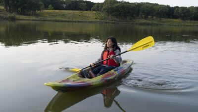 A person in a kayak outdoors.