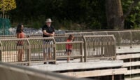 People fishing at a pier.