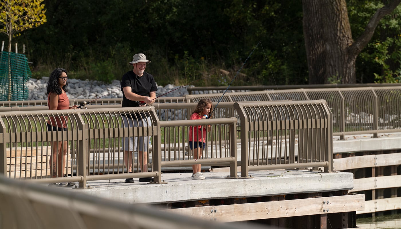 People fishing at a pier.